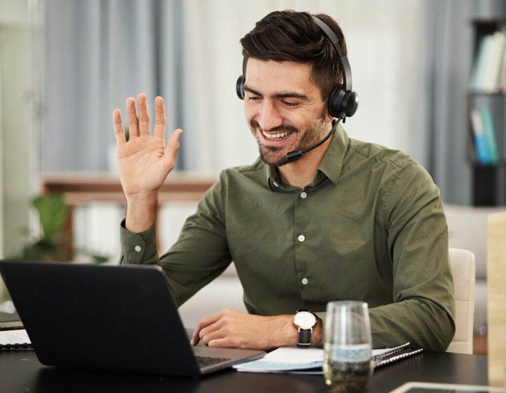 Man remote work and virtual assistant with headphones at laptop for video call voip communication - Image from Inkfire Limited