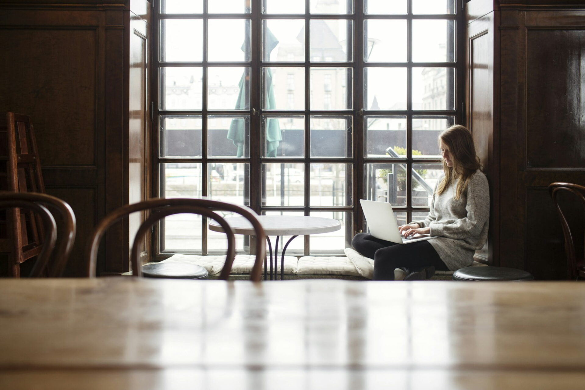 A serene moment of productivity in a classic coffee shop setting - Image from Inkfire Limited