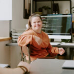Female programmer looking at coworker 2025 05 13 09 41 59 utc scaled 1 - Image in article: Back To Work Scheme: Empowering Disabled Talent Through Real-World Experience
